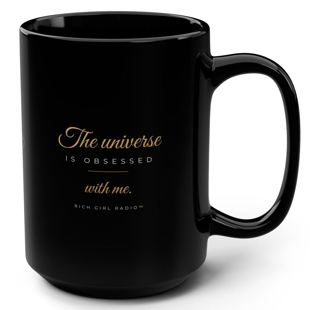 1. Black 15oz The Universe Is Obsessed With Me affirmation mug with gold script, handle on the right
2. Black and gold Rich Girl Radio celestial coffee mug, handle on the left
3. Side view of glossy black 15oz ceramic mug showing C-shaped handle
4. Back of black celestial mug with gold ringed planet design
