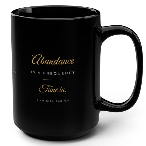 1. Black 15oz Abundance Is a Frequency affirmation mug with gold script, handle on the right
2. Black and gold Rich Girl Radio affirmation coffee mug, handle on the left
3. Side view of glossy black 15oz ceramic mug showing C-shaped handle
4. Back of black affirmation mug with gold frequency sound wave design