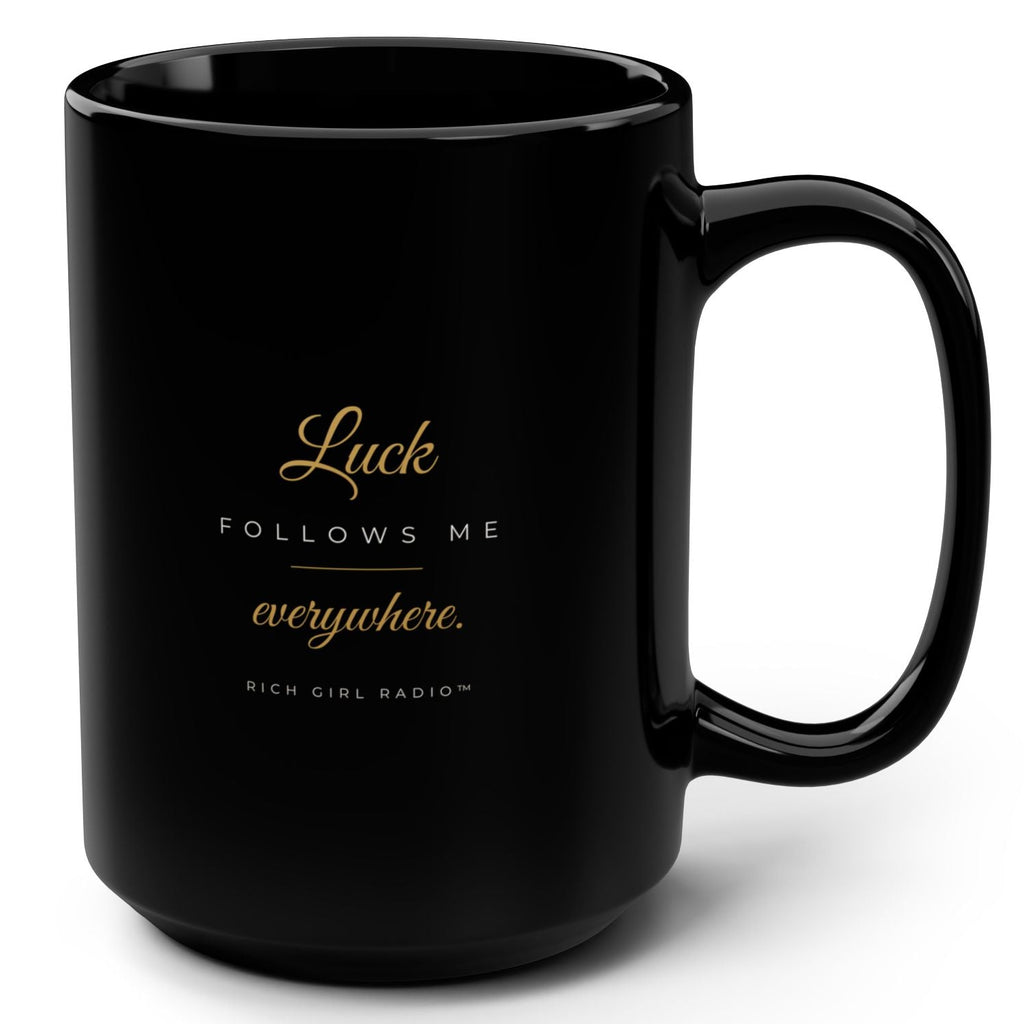 1. Black 15oz Luck Follows Me Everywhere affirmation mug with gold script, handle on the right
2. Back of black lucky mug with gold heart four-leaf clover design
3. Black and gold Rich Girl Radio Luck Follows Me Everywhere coffee mug, handle on the left
4. Side view of glossy black 15oz ceramic mug showing C-shaped handle