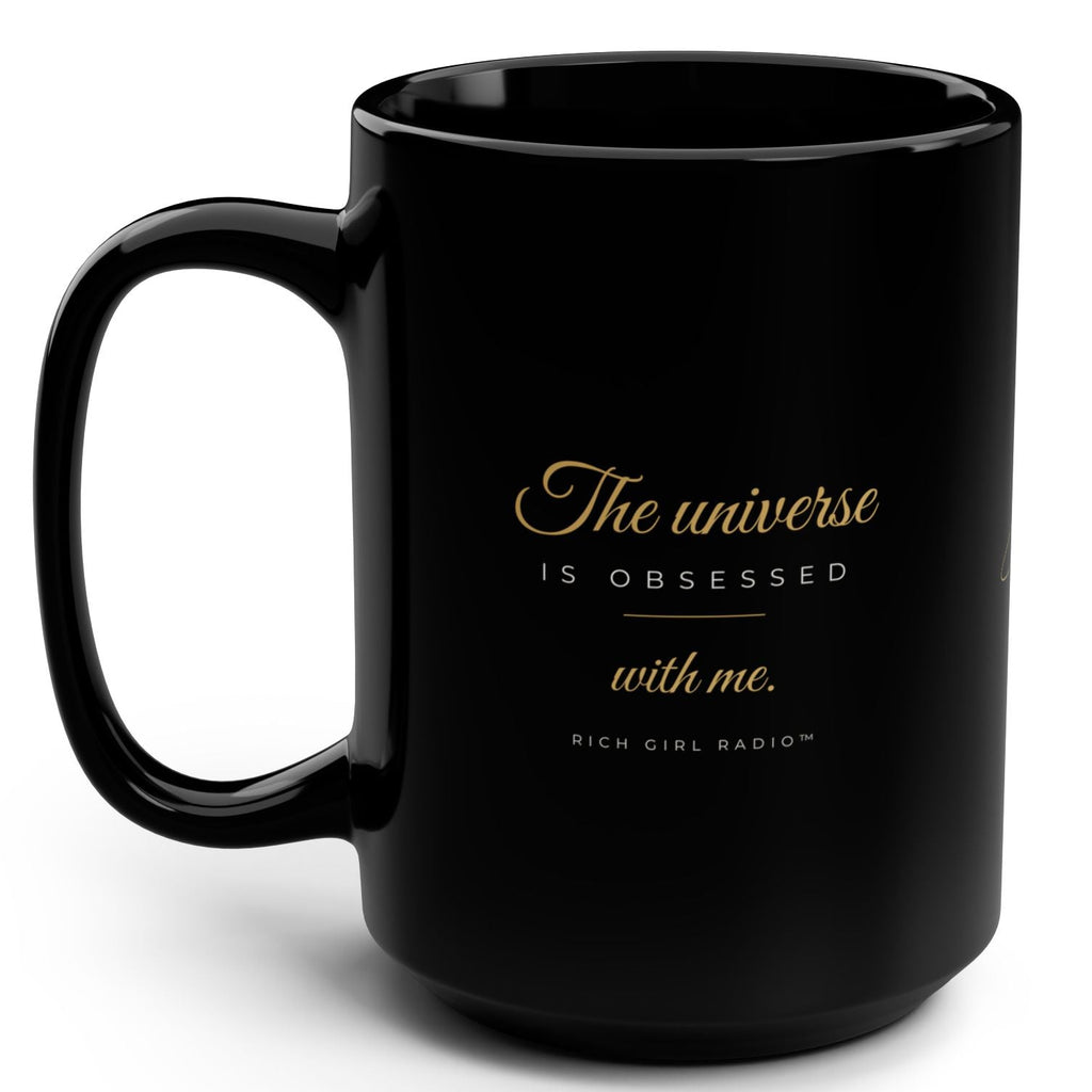 1. Black 15oz The Universe Is Obsessed With Me affirmation mug with gold script, handle on the right
2. Black and gold Rich Girl Radio celestial coffee mug, handle on the left
3. Side view of glossy black 15oz ceramic mug showing C-shaped handle
4. Back of black celestial mug with gold ringed planet design